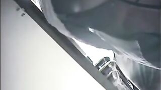 The hidden camera at the checkout captures girls' skirts
