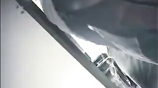 The hidden camera at the checkout captures girls' skirts