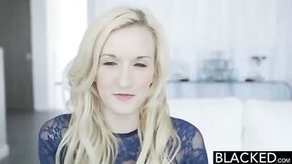 A blonde girl plays with a vibrator while fucking a black guy