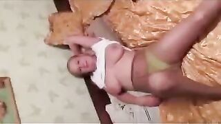 A pregnant girl has a photo session with her big boobs