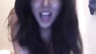The Asian girl is masturbating quietly on her bed