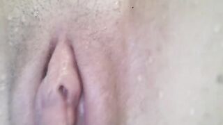 A hot close-up shot of a pussy while having an orgasm underwater