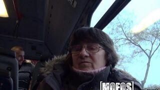 A brunette woman has sex with a stranger on the bus