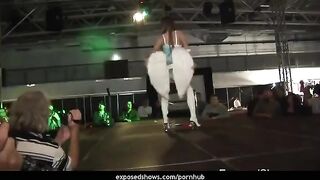 A hot brunette learns how to dance on the strip pole and remove clothes