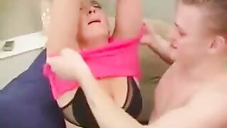 A hot woman is having sex with a man in a chair, getting wild