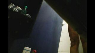 A hidden camera filmed a girl's shower and shaved pussy