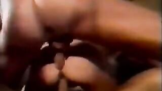 Sperm exchange through hands in a swinging group scene