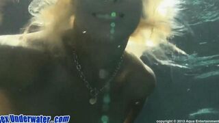 A blowjob scene shot right in the water, featuring a hot blondie