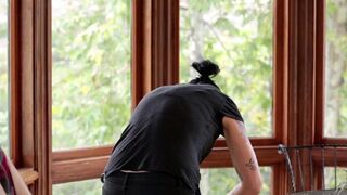 Vietnamese beauty fucks her new girlfriend in the kitchen with a strap-on