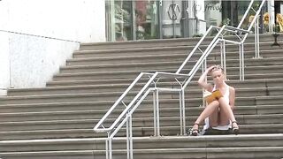 A girl walks without panties on the city streets