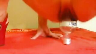 Bottles and fisting go hand in hand for some, especially with a large dildo