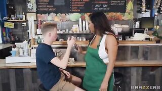 A girl with big boobs works as a barista in the coffee shop