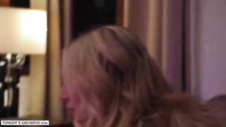 Busty blonde porn star Kayley Gunner gives a foot job while wearing pink stockings