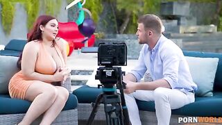 A busty woman is being interviewed and fucked in her ass during the chat