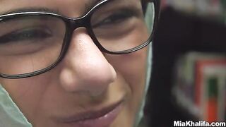 The sexy Mia Khalifa reads a book in the library before getting horny