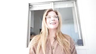 A blonde girl sucks a dick under the table and gets a huge load on her face