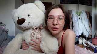 The young girl has an intimate moment with her favorite teddy bear
