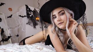 A cute witch in a white dress waits for magical sex