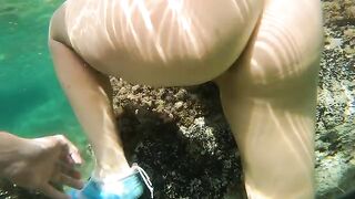 The couple has anal sex right in the sea and gets a cumshot