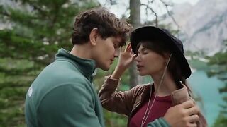 A couple making love outdoors in the forest, captured in cinematic HD