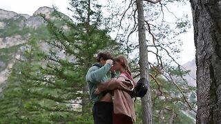 A couple making love outdoors in the forest, captured in cinematic HD