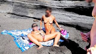A girl undresses on the beach and masturbates while a guy jerks off