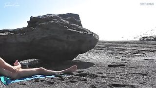 A girl undresses on the beach and masturbates while a guy jerks off