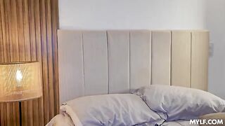 A blonde girl got a wild idea on top of her partner on the bed
