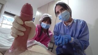 A man was examined by two hot nurses in the hospital