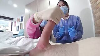 A man was examined by two hot nurses in the hospital