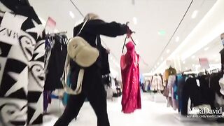 A babe is almost caught while sucking cock in the fitting room